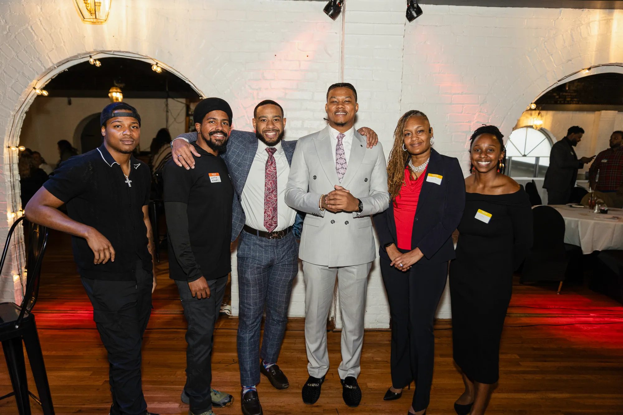 Six people from the Agency AF team and their guests standing together at an event.